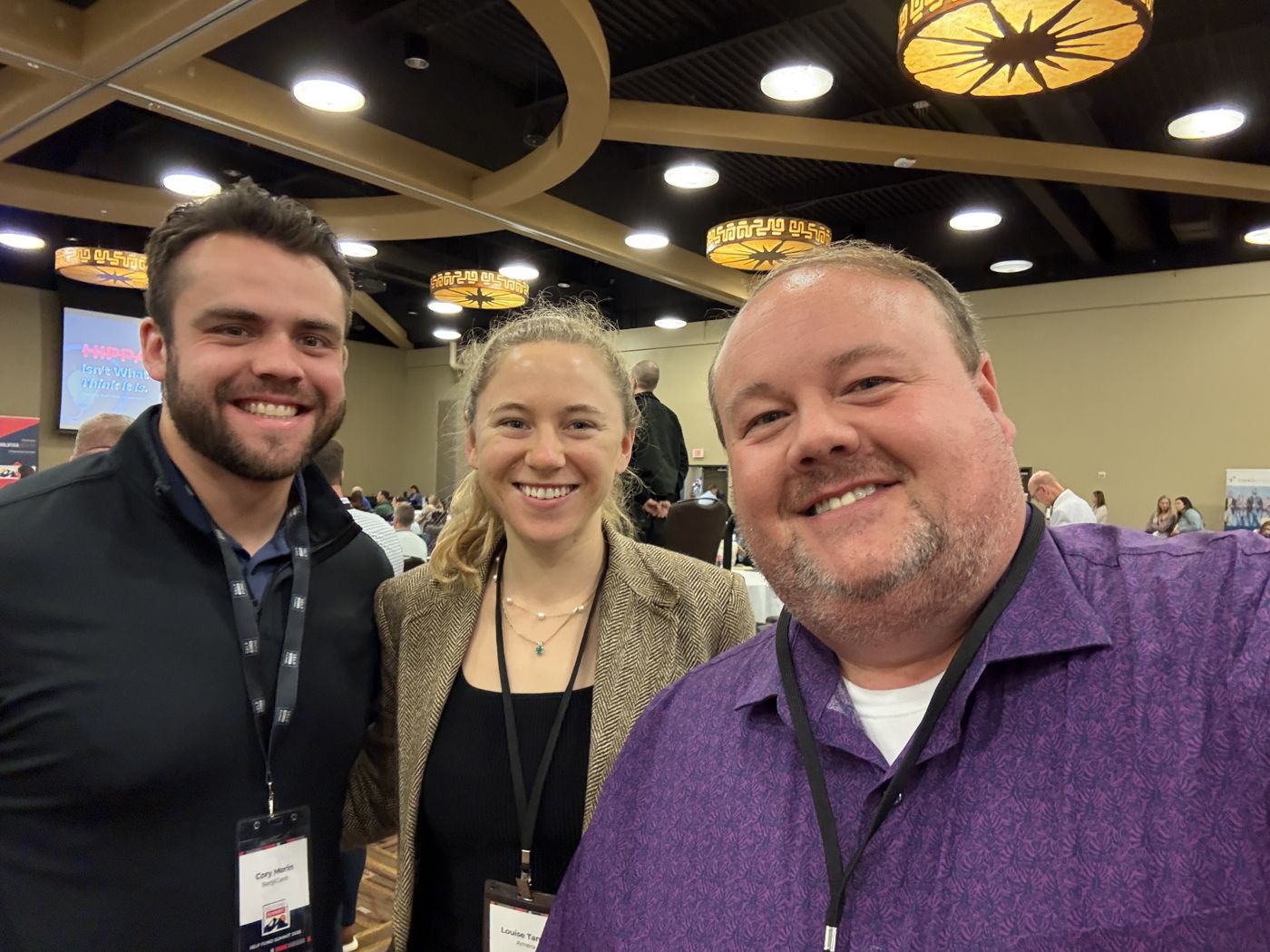 Trey Hinson with colleagues at a conference